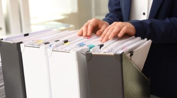 Organized Paperwork Documents in File Folders at Office