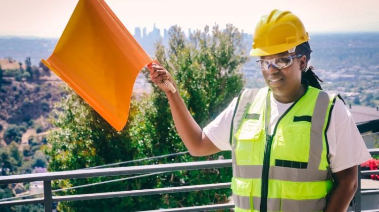 Handywoman Holding a Signal Flag