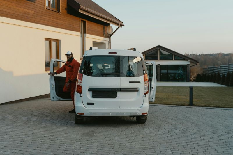 branded service van at a residential job site - commercial insurance and warranties