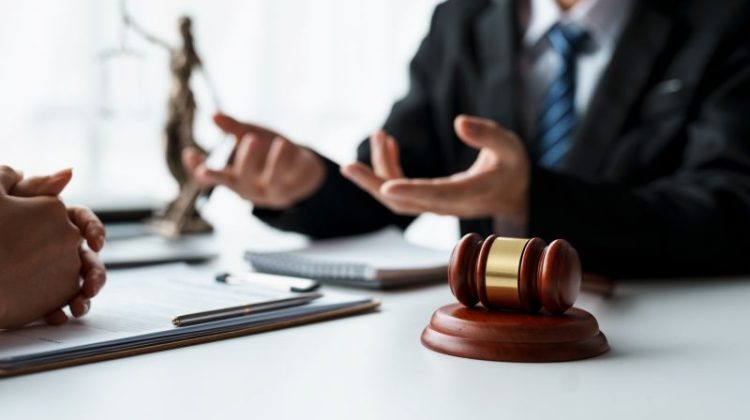 Lawyer Consults with Client in Office Setting