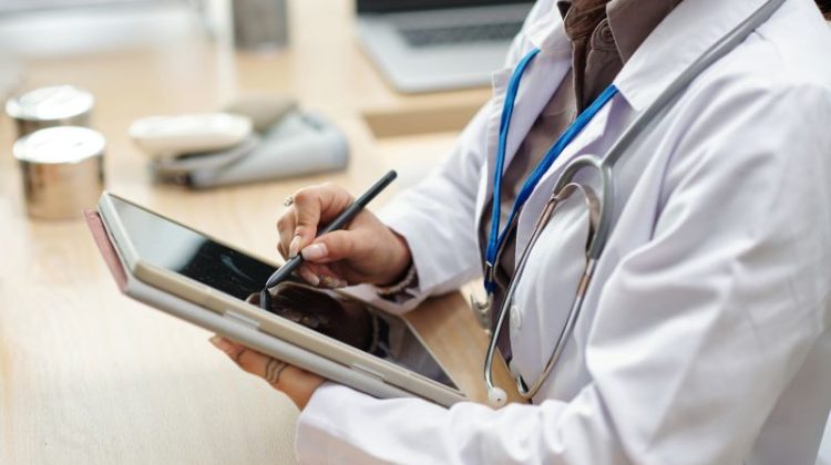 Medical Professional Working with Tablet in Office