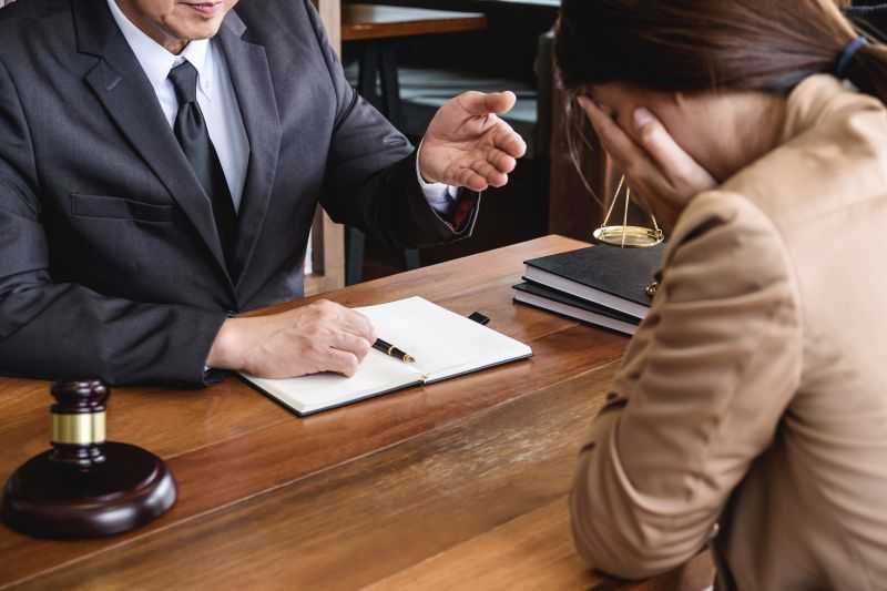 Troubled Woman with Attorney in Office