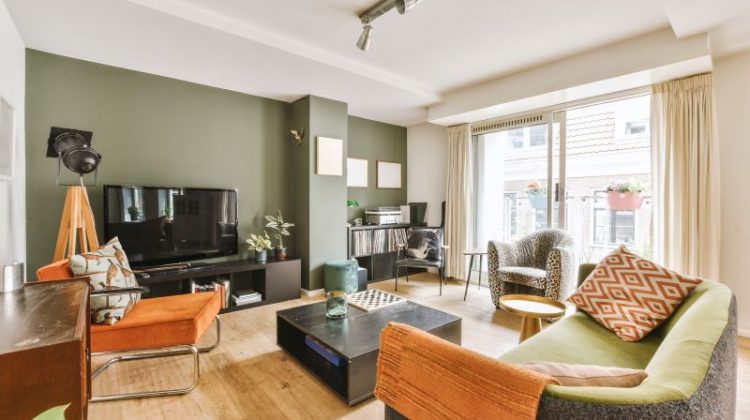 Modern studio apartment interior with wooden furniture