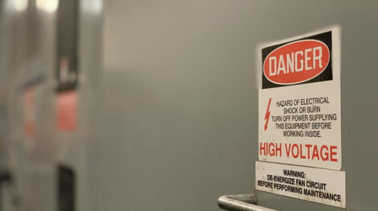 Danger High Voltage Sign on Electrical Switchgear Equipment
