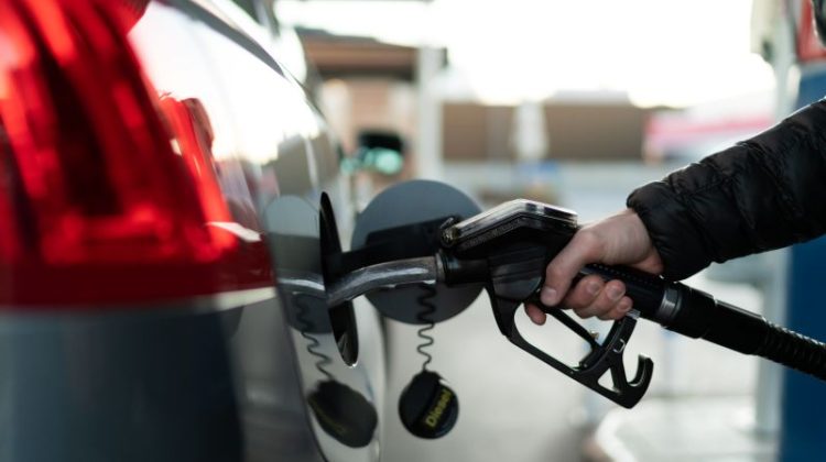 Man Filling Up Car with Diesel Fuel
