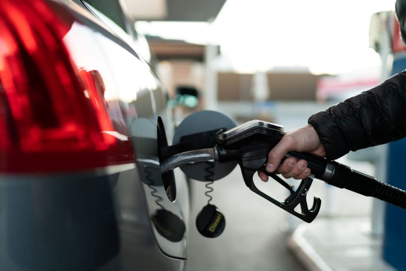 Man Filling Up Car with Diesel Fuel