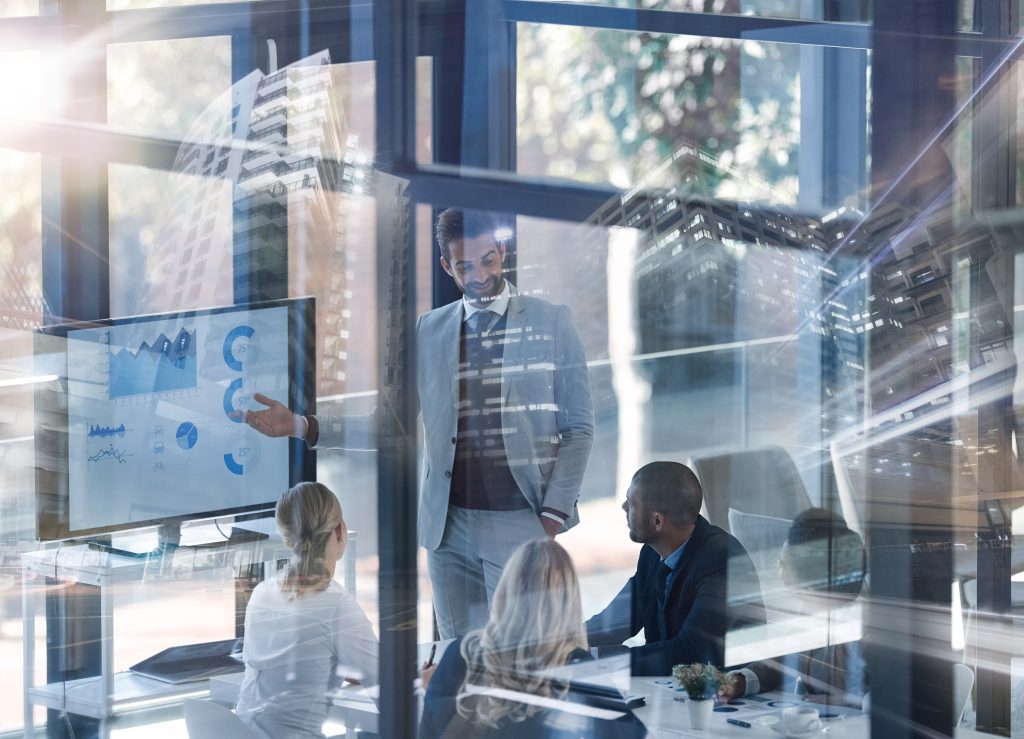 Business Professionals Meeting Analyzing Data in Conference Room 