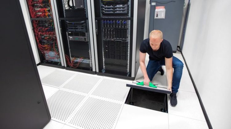 Technician Working in a Server Room