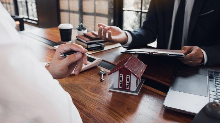 Real Estate Professional Meeting in Modern Office