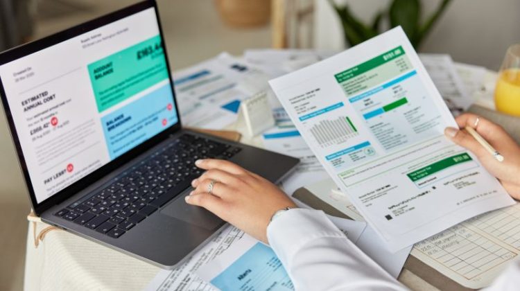Cropped shot of unknown accountant and bookkeeper makes audit of expenses works with financial