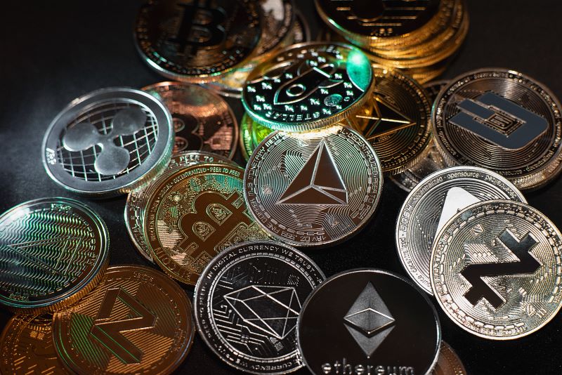 Collection of Various Digital Cryptocurrency Coins on Black