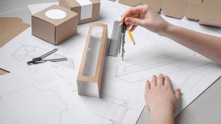 Packaging Design Process with Compass and Drawings
