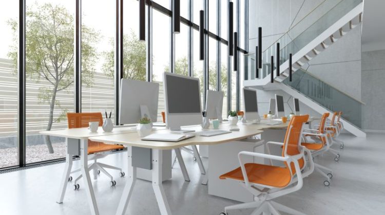 Modern Workplace Interior with Desks and Orange Chairs