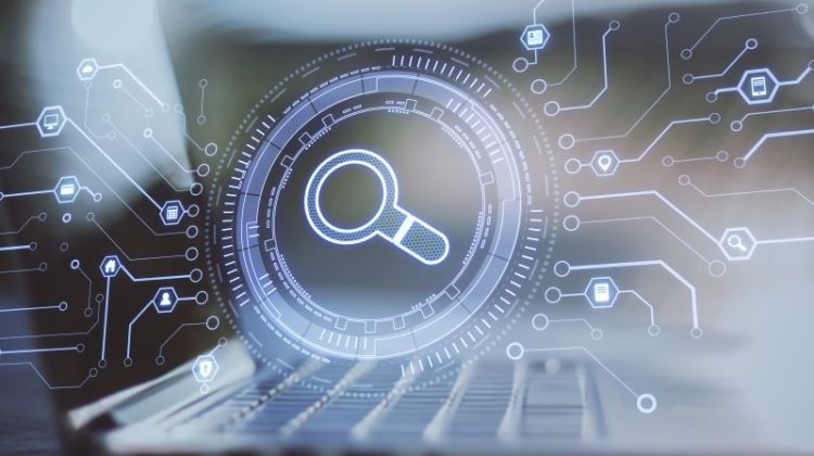 Technology Search Concept with Laptop and Magnifying Glass