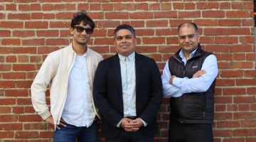 Autoheal founders Utkarsh Ohm, Sid Choudhury and Puneet Saraswat standing together in front of a brick wall.