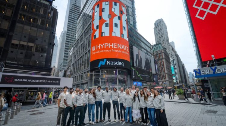 Hyphenate team in Times Square celebrating the company rebrand from Maximor on the Nasdaq digital billboard