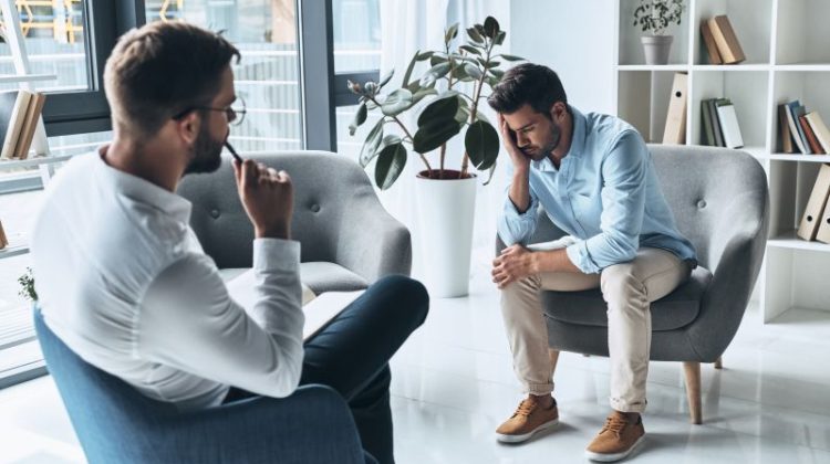 Man discussing mental health concerns during a counselling session