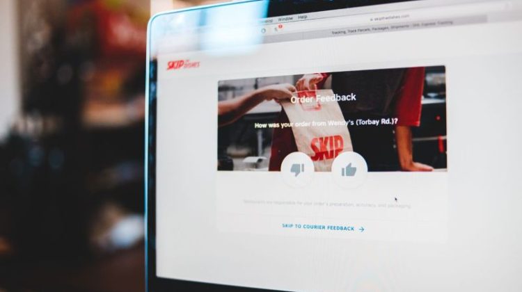 Laptop displaying an online customer feedback page, illustrating the online enquiry process for small businesses