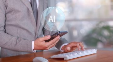 Business professional using a smartphone with an AI technology graphic.